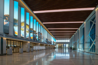 Airport concourse with floor-to-ceiling windows