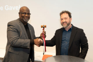 The passing of the gavel from 2025 AIANY President Benjamin Gilmartin, AIA, to 2026 AIANY President Mark Gardner, AIA, NOMA. Photo: Samuel Lahoz.