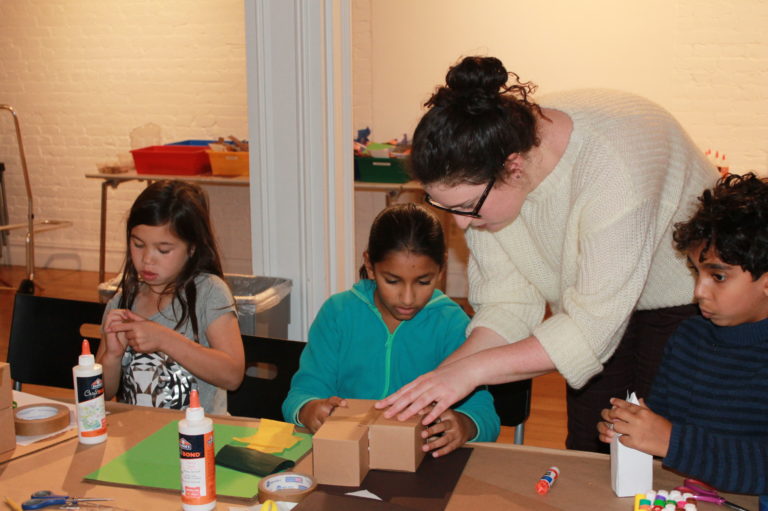 Design Educator Breanna Katsman assists Maya with her model. Credit: Center for Architecture.