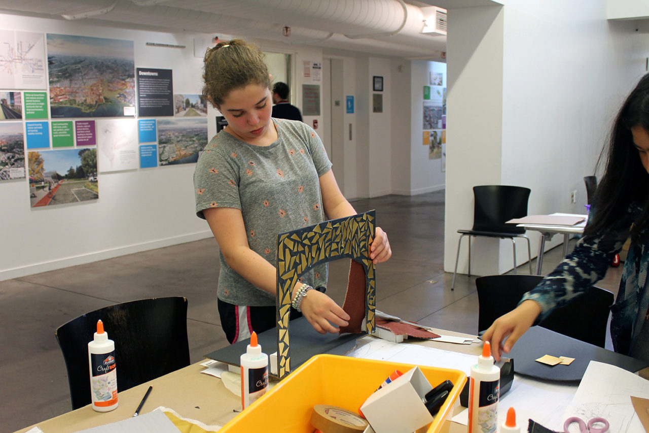 Lily tests out her proscenium arch and frames her stage curtains. Credit: Center for Architecture.