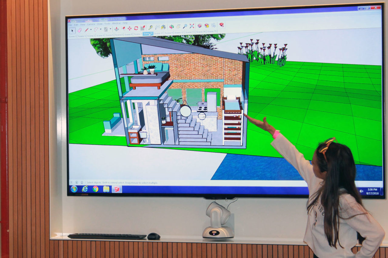 A middle school student presents her design for a tiny house created in SketchUp.