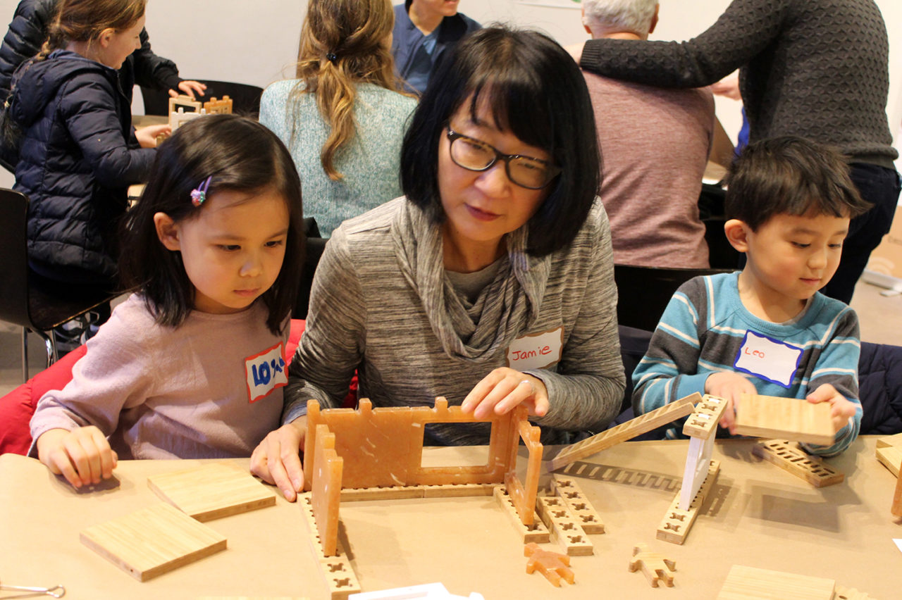 Participants of all ages happily set to work creating their own tropical houses. Image credit: Center for Architecture.