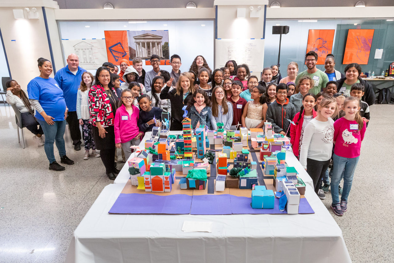 Participants gather for a photo behind the completed city model. Image Credit: Matthew Lapiska (DDC).
