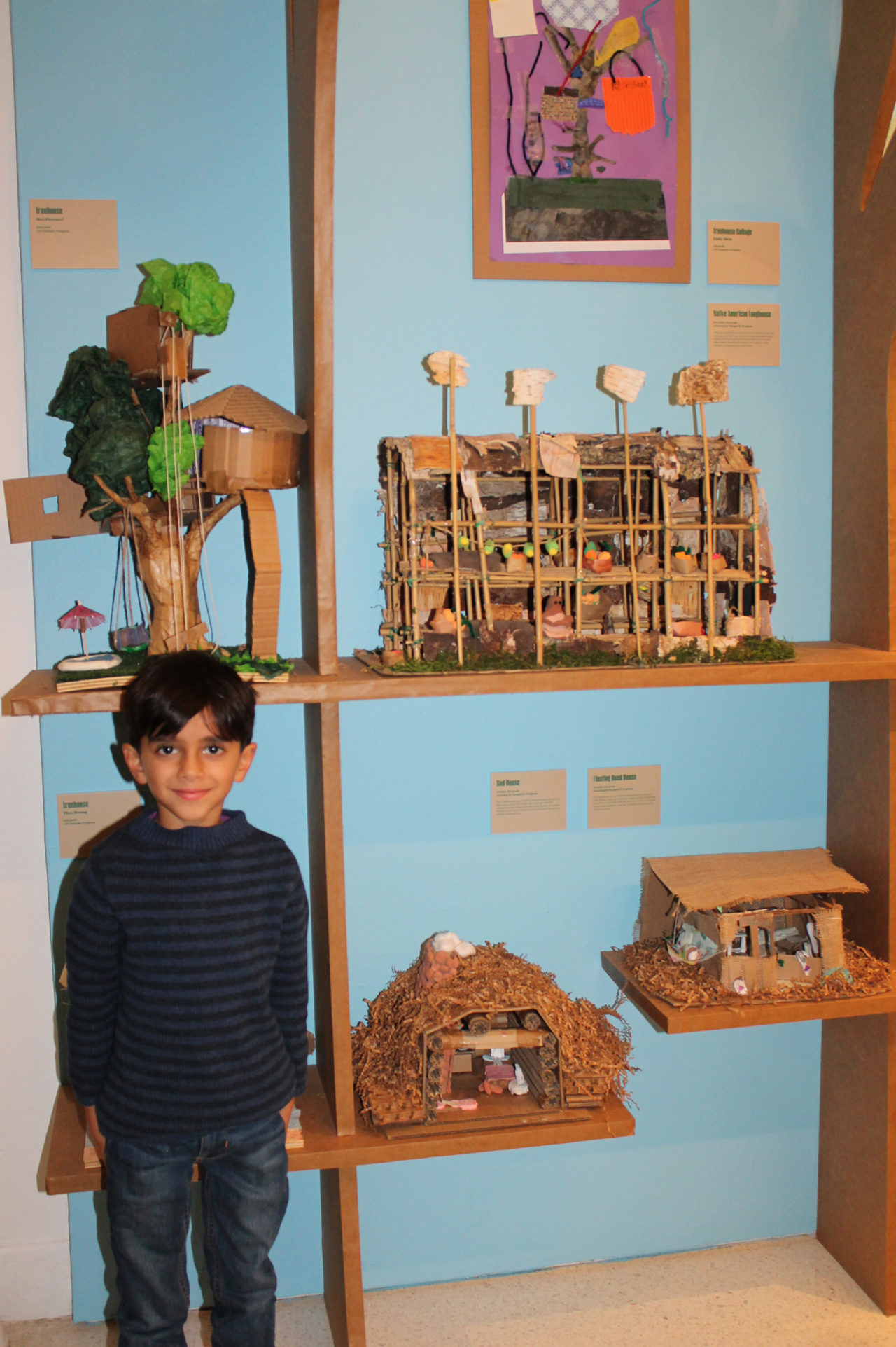 Max Procacci poses with the treehouse he designed as a rising 3rd grader in the Center’s summer 2019 program. Image credit: Center for Architecture.