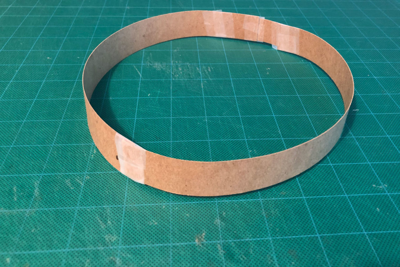 Glue or tape strips together until it is long enough to wrap around your head. Fasten the long strip into a circle so it can be placed on top of your head like a paper crown.