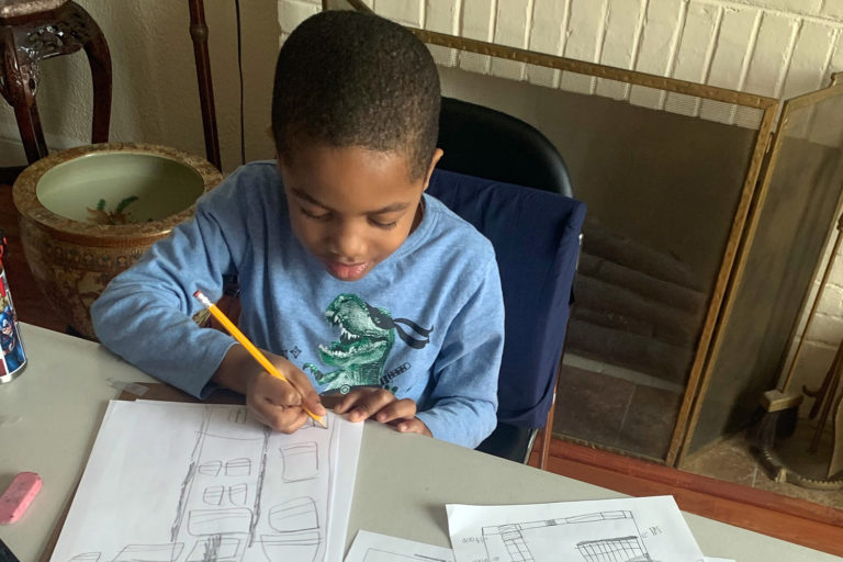 A workshop participant designs a building with newly-learned architectural vocabulary. Photo: Melinda Cashwell Edwards. 