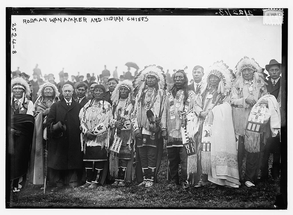 Native American chiefs with Rodman Wanamaker (1863-1928) at the groundbreaking ceremony for the National American Indian Memorial (which was never built), Fort Wadsworth, Staten Island, New York. Left to right: Cheyenne chief Wooden Leg, Cheyenne chief Two Moons, Rodman Wanamaker, Crow chief Plenty Coups, Crow chief Medicine Crow, Crow Indian White Man Runs Him, and Oglala Sioux chief Jack Red Cloud (1862-1928). Photo: Flickr Commons project, 2008, 209. George Grantham Bain Collection, Prints & Photographs Division, Library of Congress, LC-B2- 2524-9