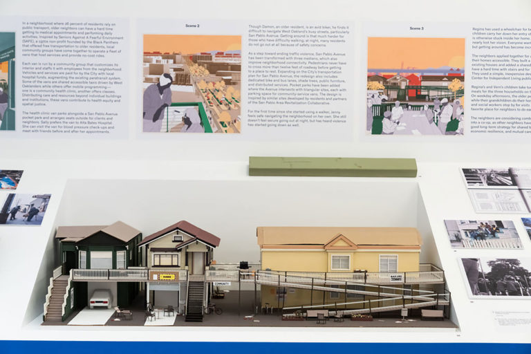 Three-dimensional model of three houses with pitched roofs that share a common porch that is accessible via two sets of stairs and one long ramp.