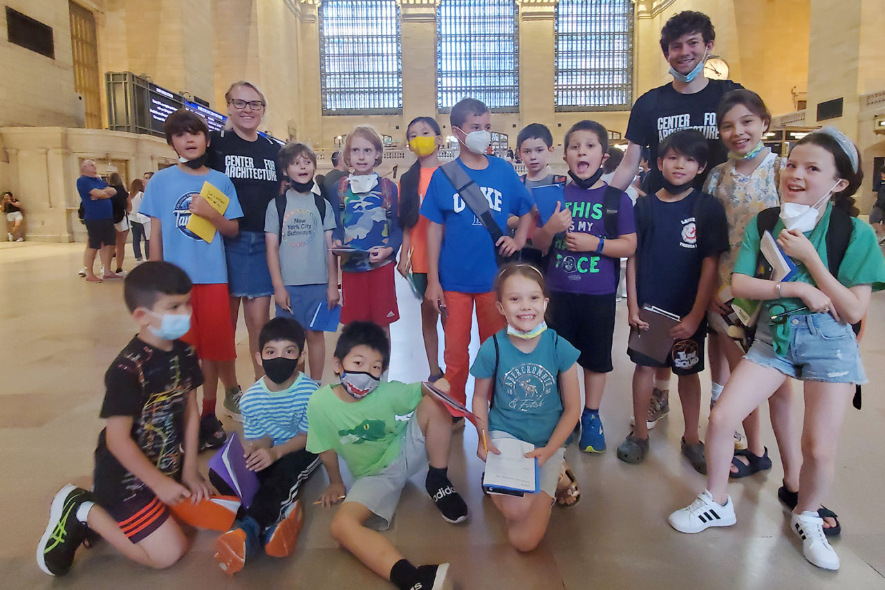 Group of students stands inside Grand Central Terminal.