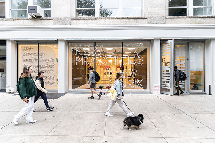 The Center for Architecture exterior with people passing by on the sidewalk