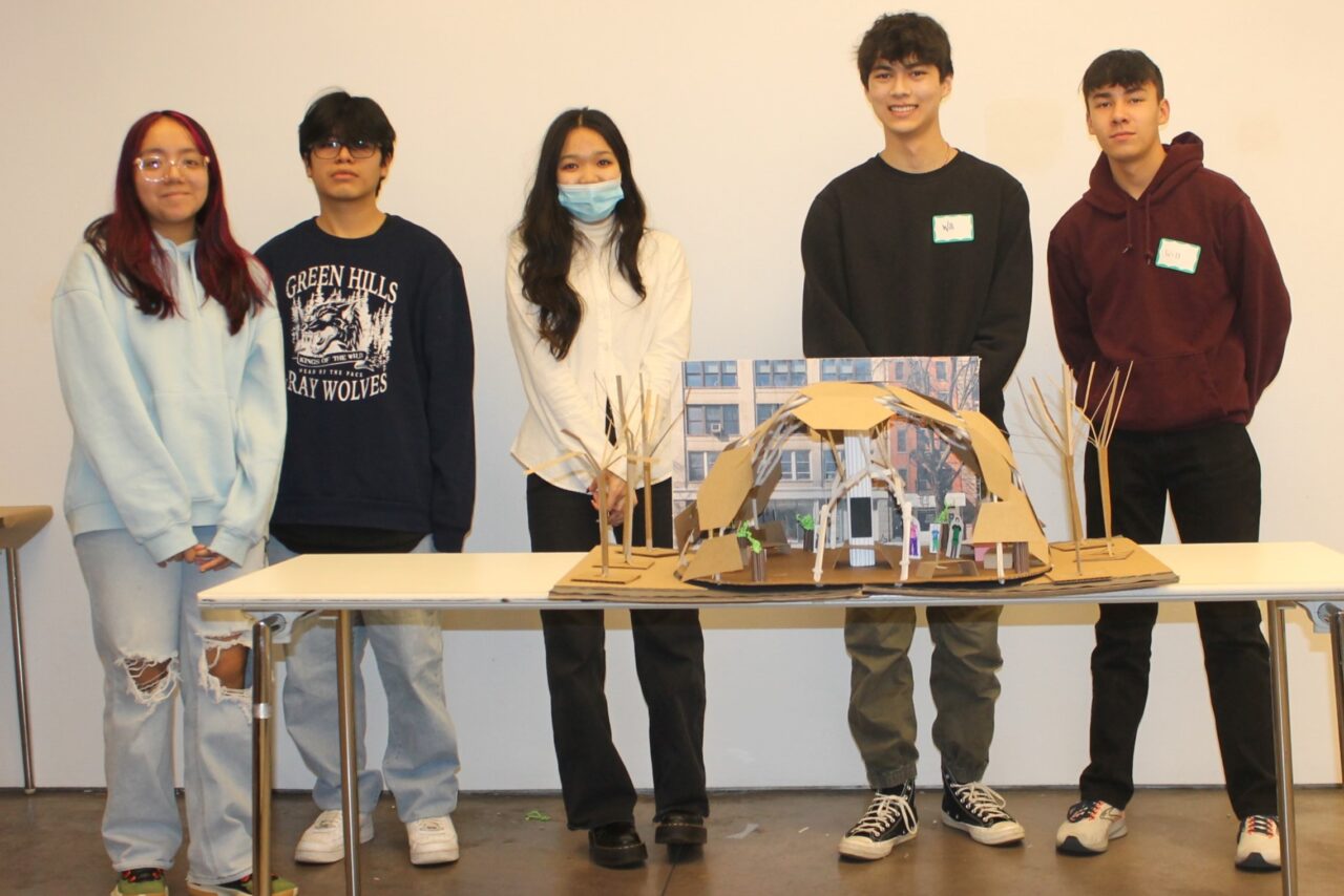 Five high school students with model of a pavilion