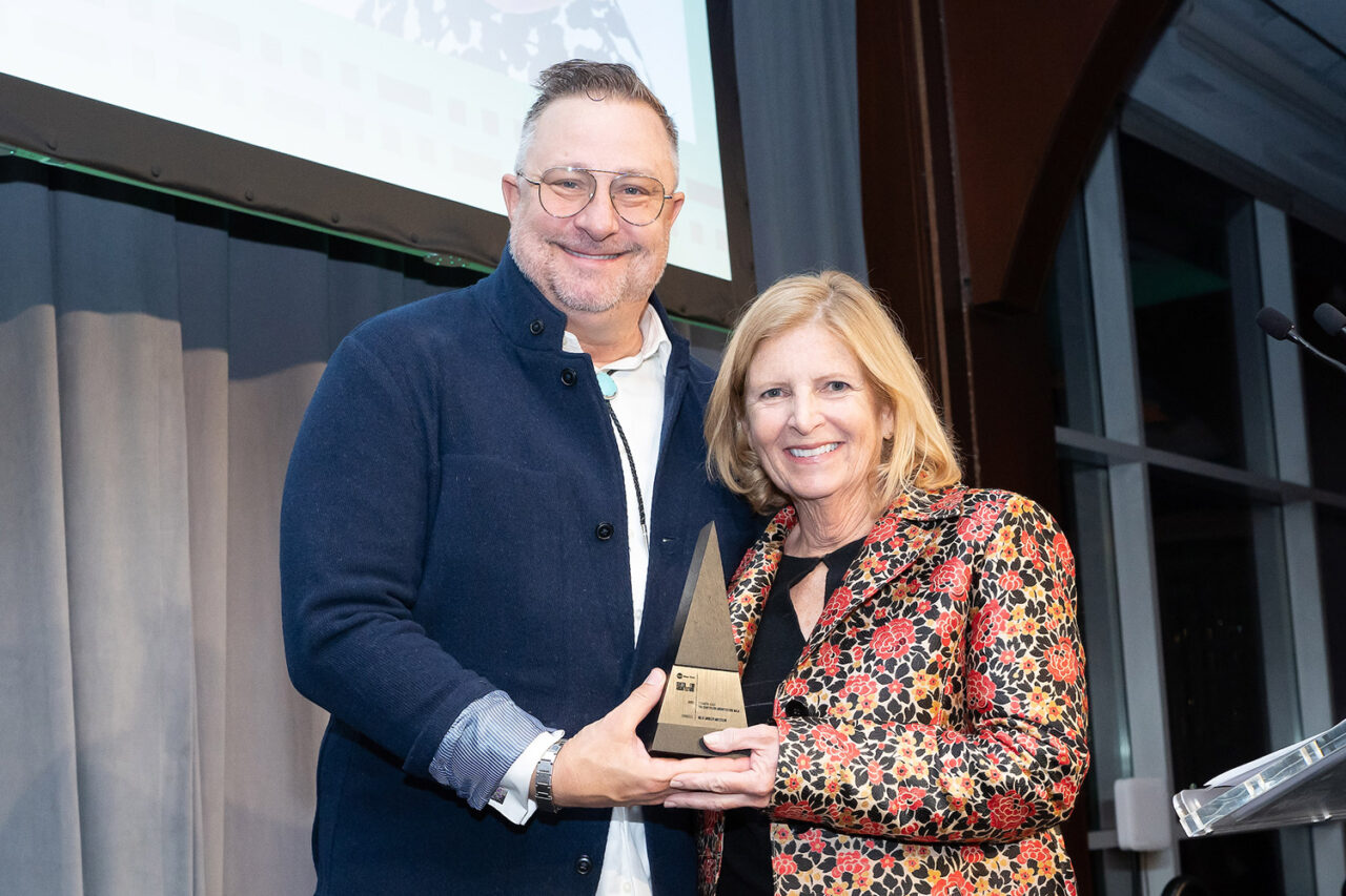 Honoree Jolie Andler Milstein accepts her award from AIANY President Matthew Bremer, AIA