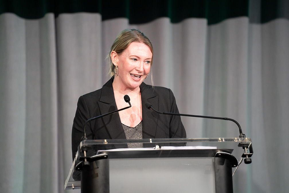 Emma Davidson giving remarks at the podium