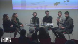 Five people sitting in a semicircle in front of an audience.