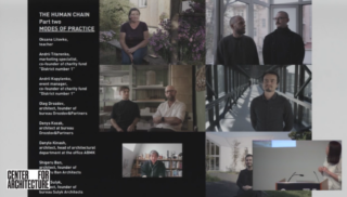 A person standing in front of a podium with a presentation behind them.