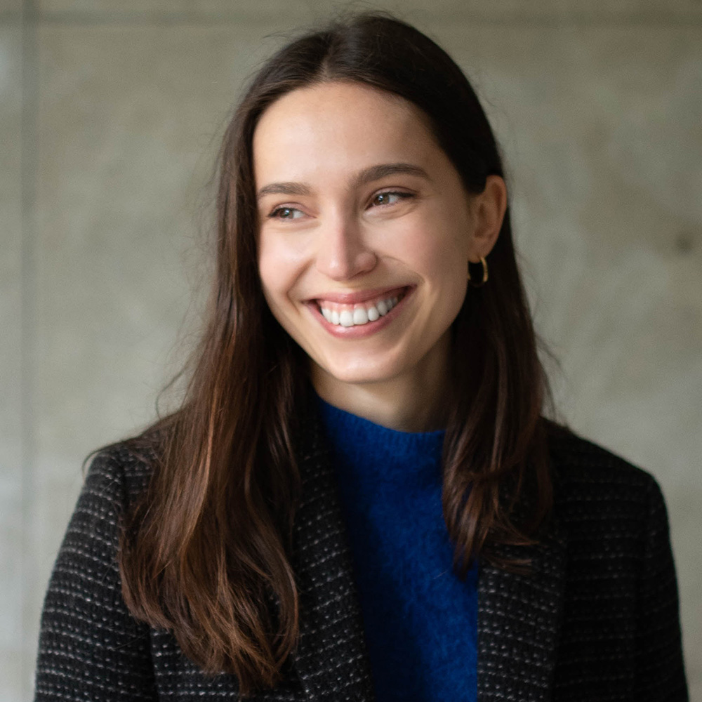 Headshot of a woman with long dark brown hair.