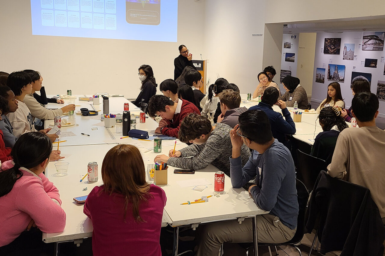 Students working around large tables at the Center for Architecture.