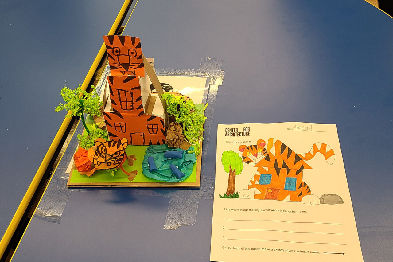 Model of tiger beside drawing of tiger