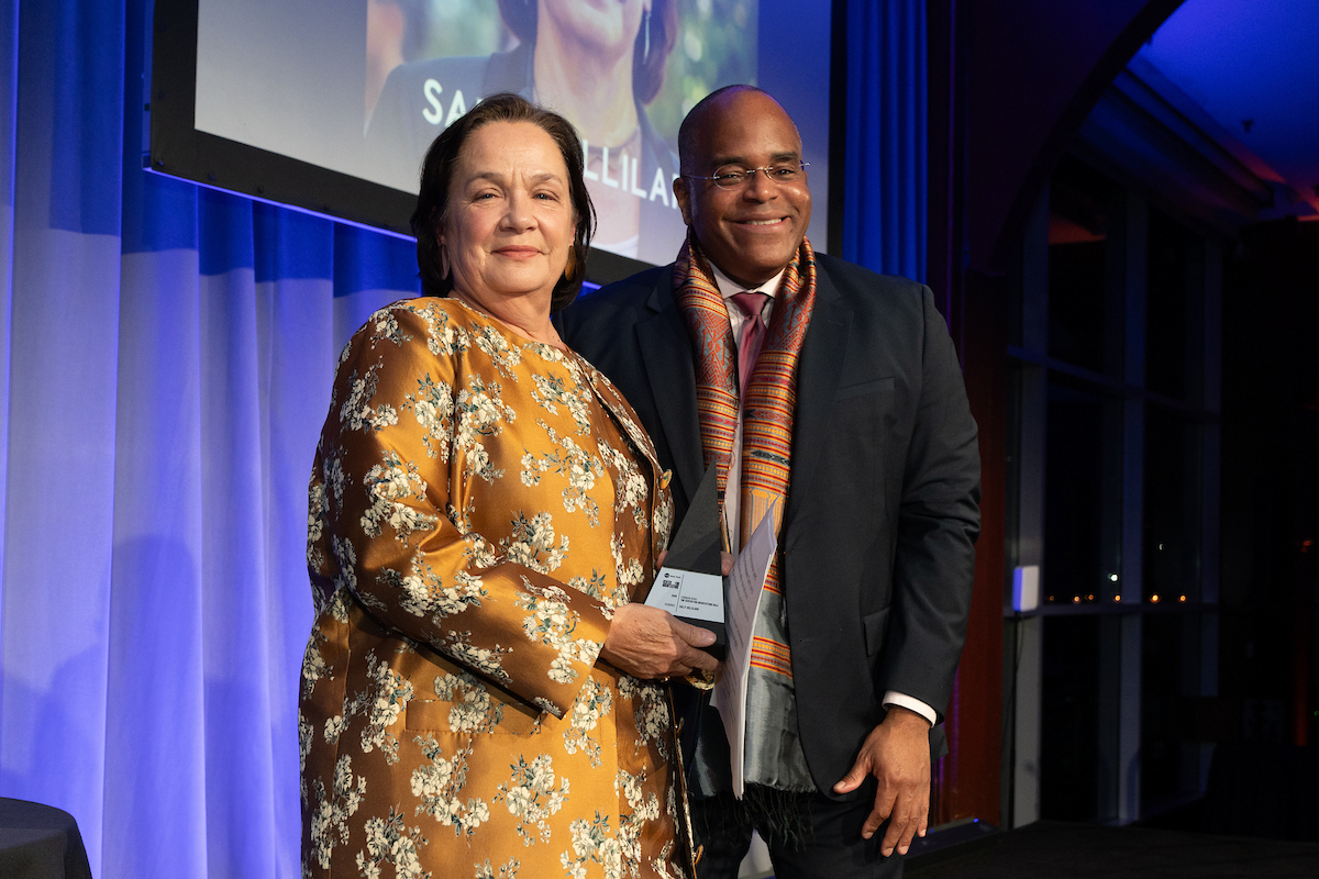 Honoree Sally Gilliland with Peter Robinson.