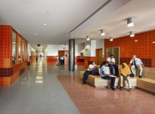 students gathered in a school lobby.